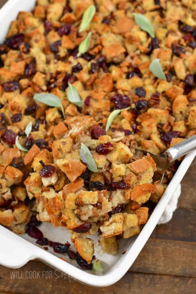 closeup of stuffing scooped with a silver spoon.