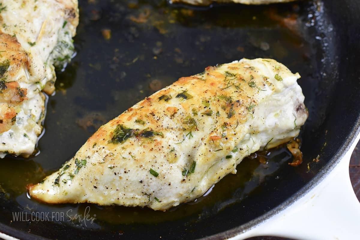 cooked stuffed chicken breast in the pan.