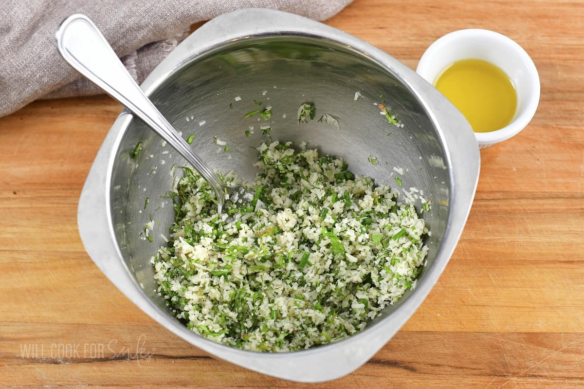 parmesan cheese and herbs filling mixed in a bowl.