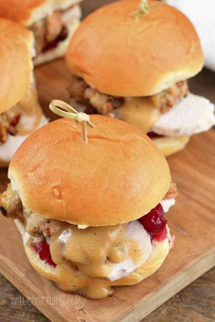 closeup top view of the two thanksgiving leftover sliders with a pick.
