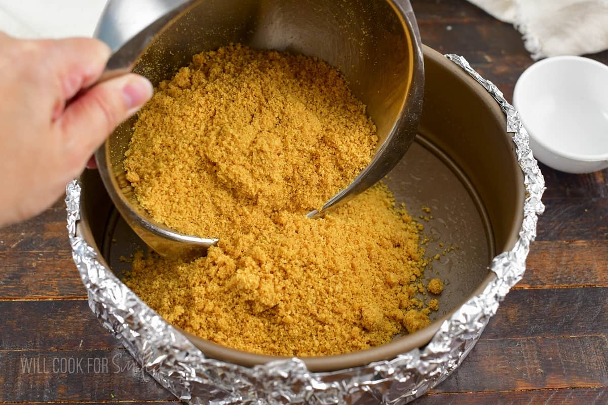 adding crust mixture into the springform.