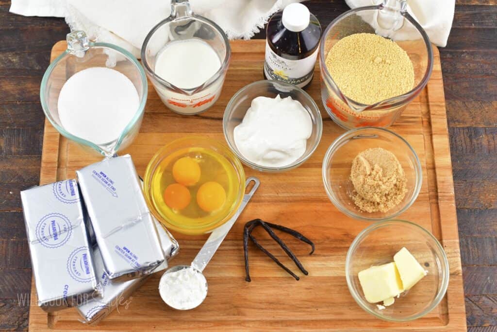 ingredients for the vanilla bean cheesecake on the cutting board.
