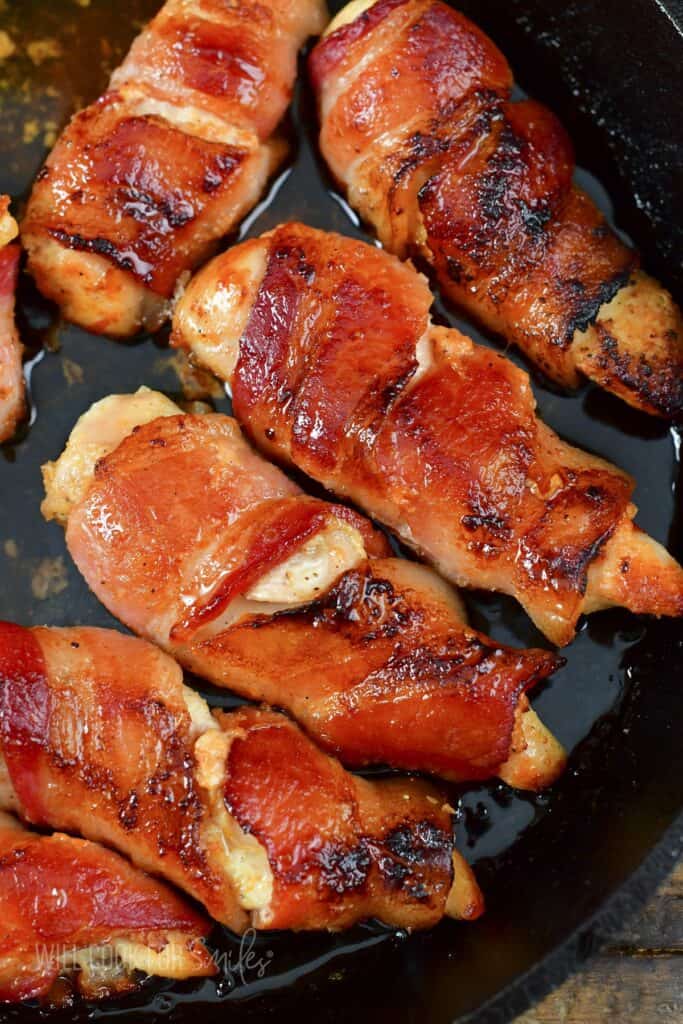 closeup of cooked bacon chicken tenders in the skiller.