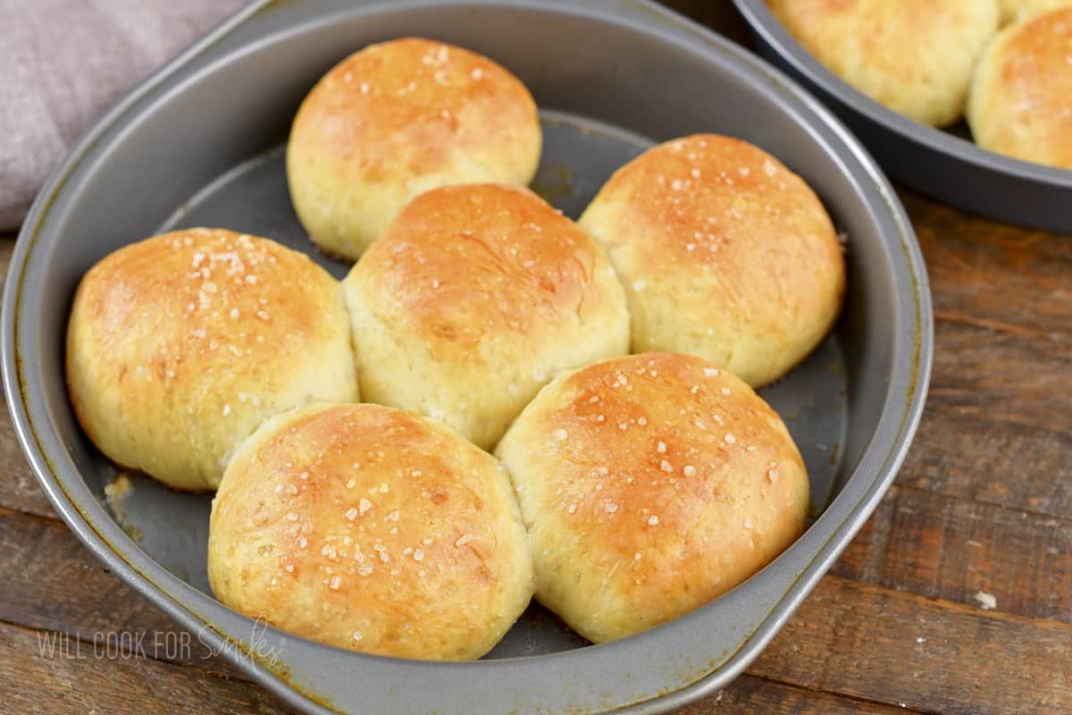 baked dinner rolls in a round baking pan.