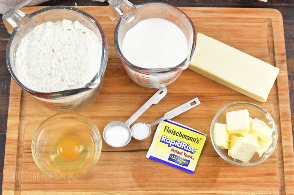 ingredients for cheesy dinner rolls on the board.
