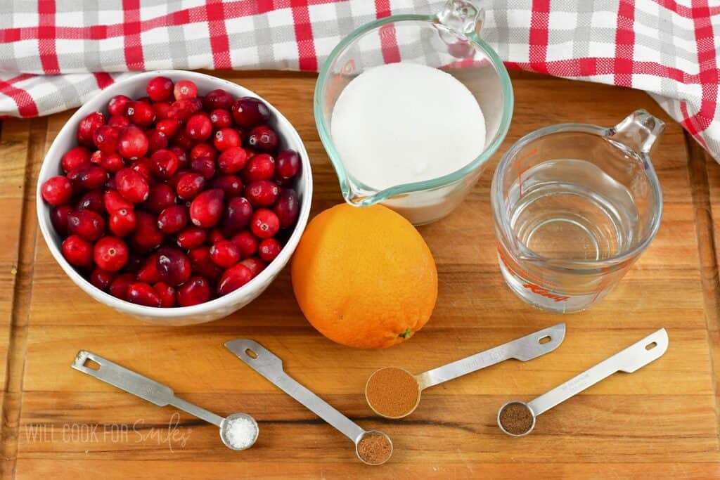 ingredients for the cranberry sauce on the board.