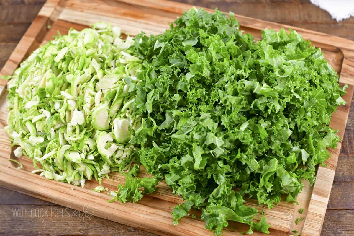 chopped kale and brussels on the cutting board.