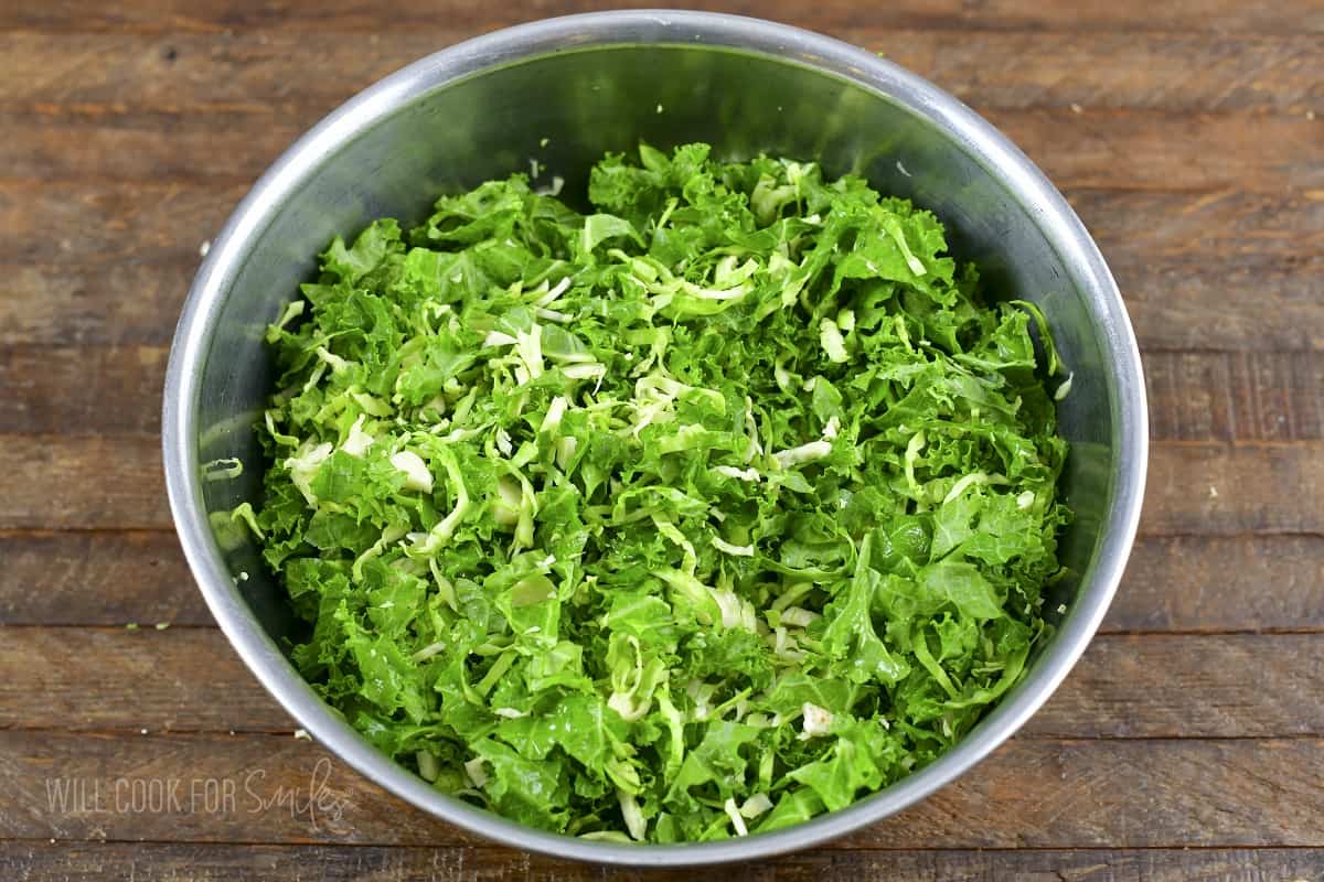 mixed kale and brussels in a salad bowl.