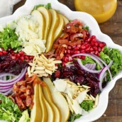 top view of the salad with layered various toppings and dressing.