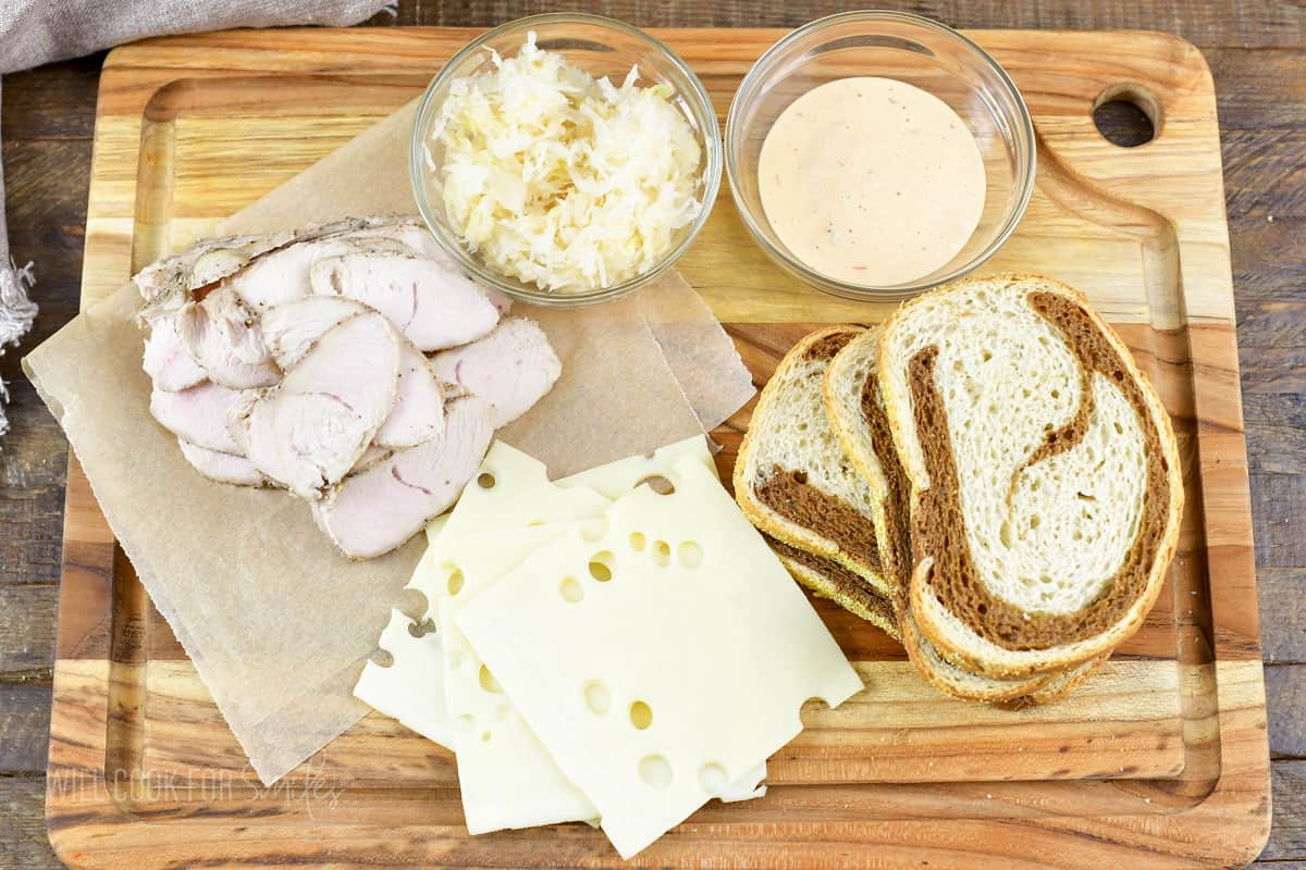 ingredients for turkey Rueben on the cutting board.