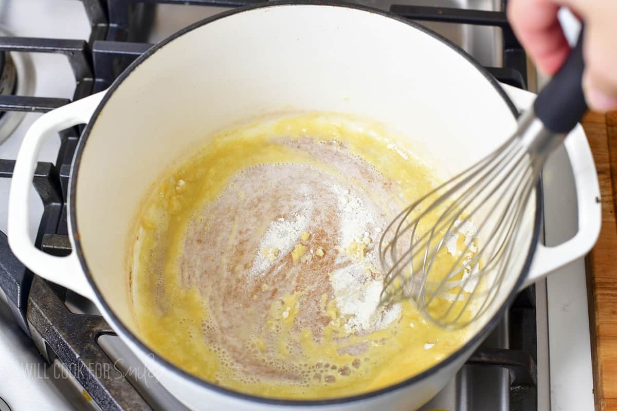 mixing flour and melted butter in a pot.