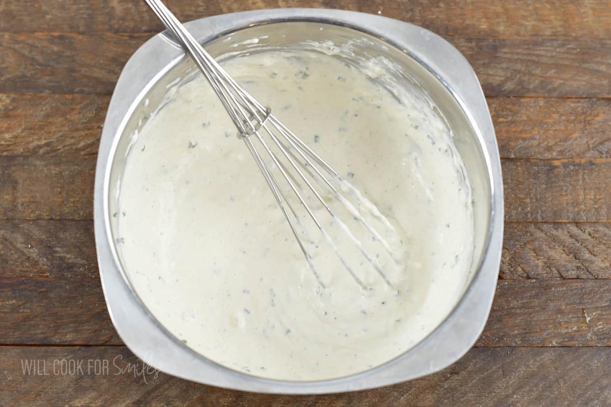 mixed white sauce in a mixing bowl.