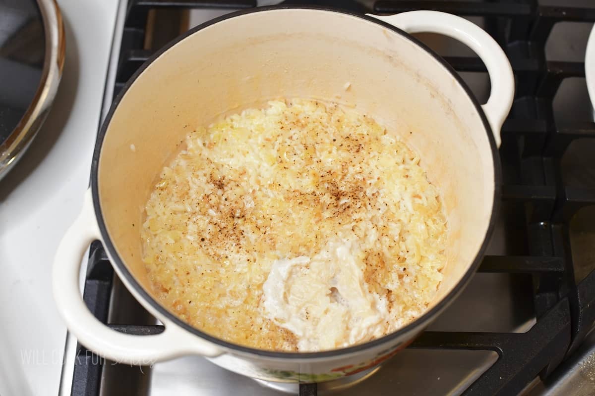 cooked creamy parmesan rice in a pot.