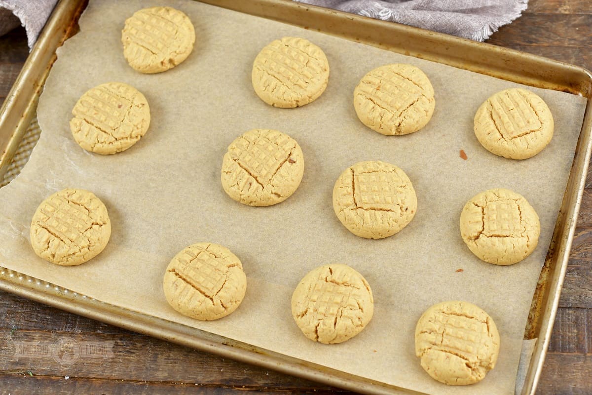 baked peanut butter cookies of the baking sheet.