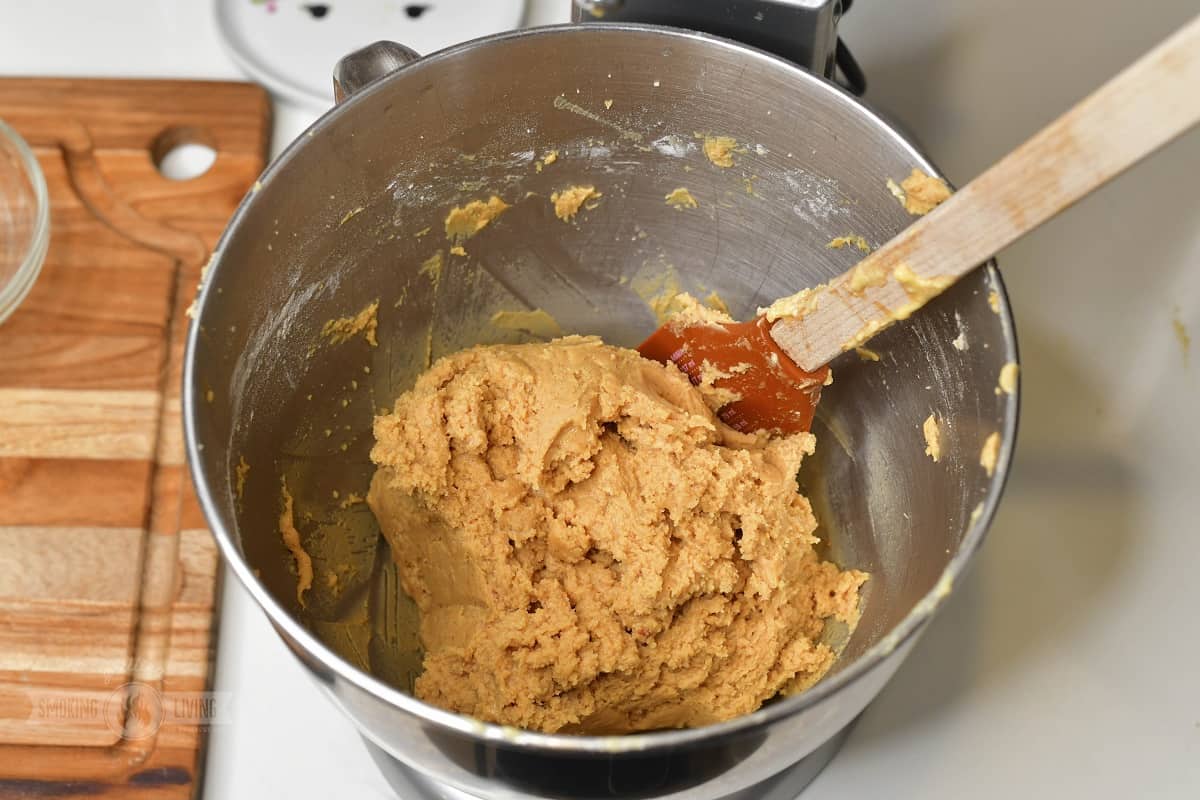 mixed peanut cookie dough in a mixer bowl.