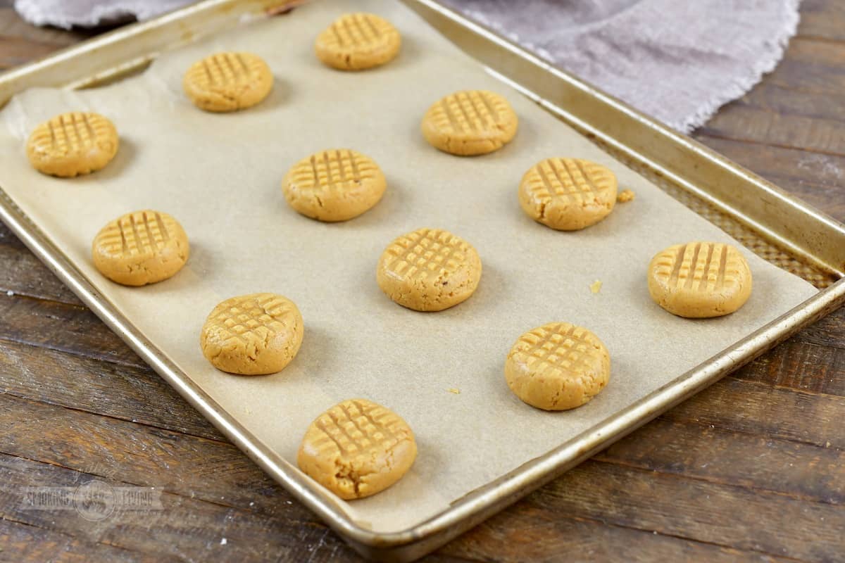 pressed cookies on the baking sheet before baking.