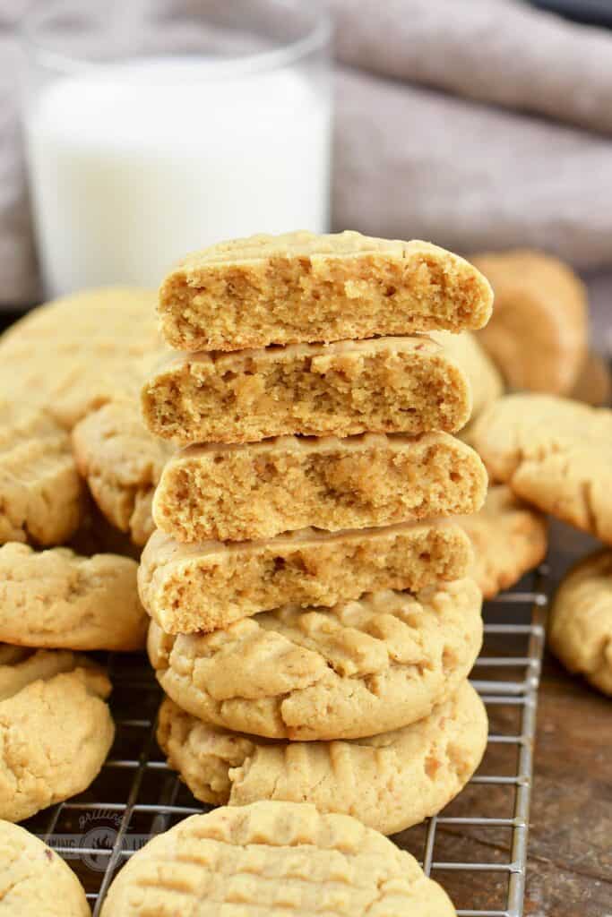 stacked peanut butter cookie halves and more around.