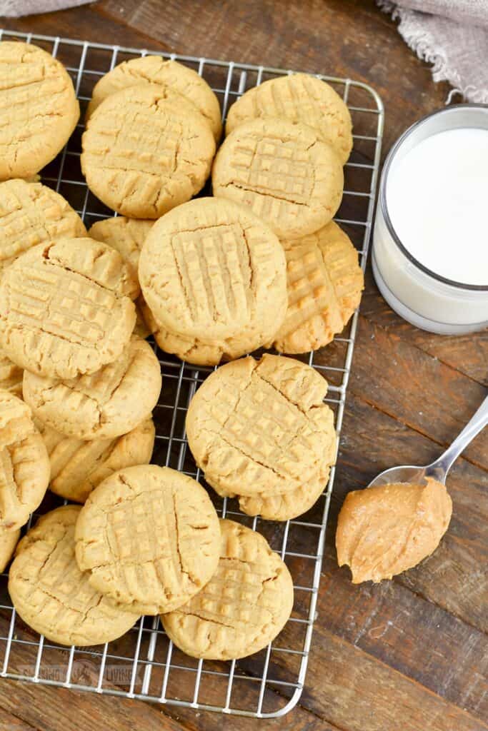top view of several peanut butter cookies on wire rack.