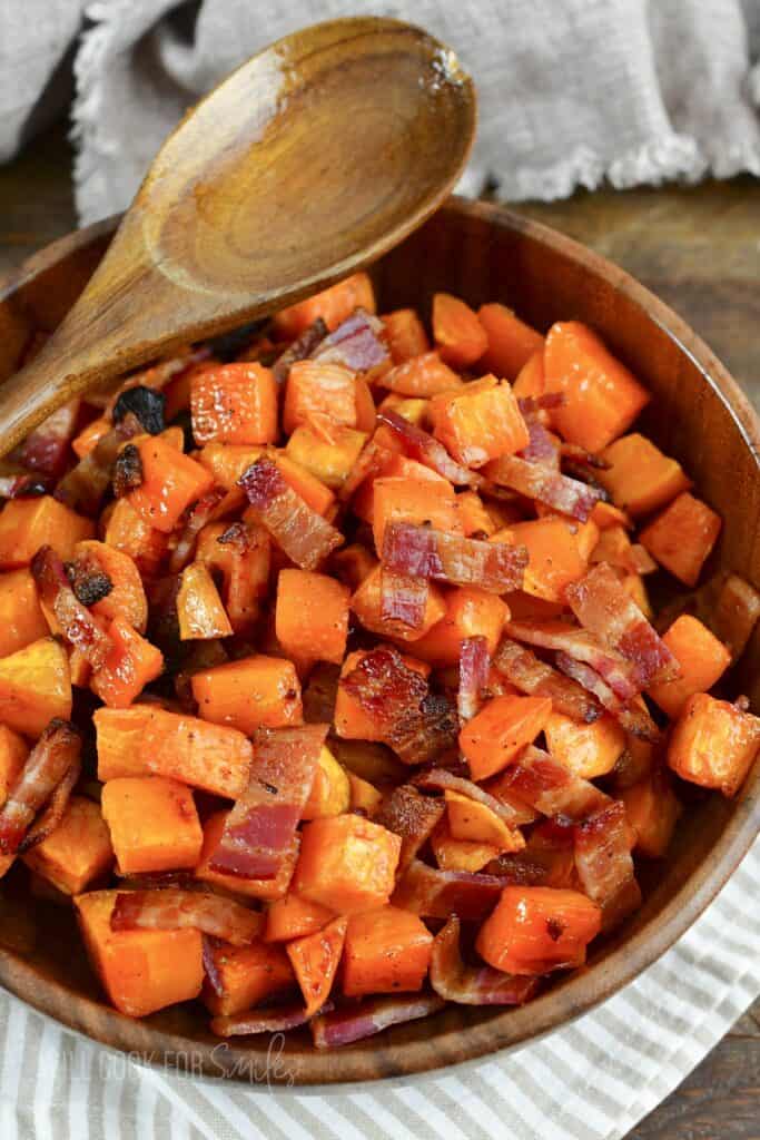 top view of the cubed sweet potatoes and bacon in a bowl.