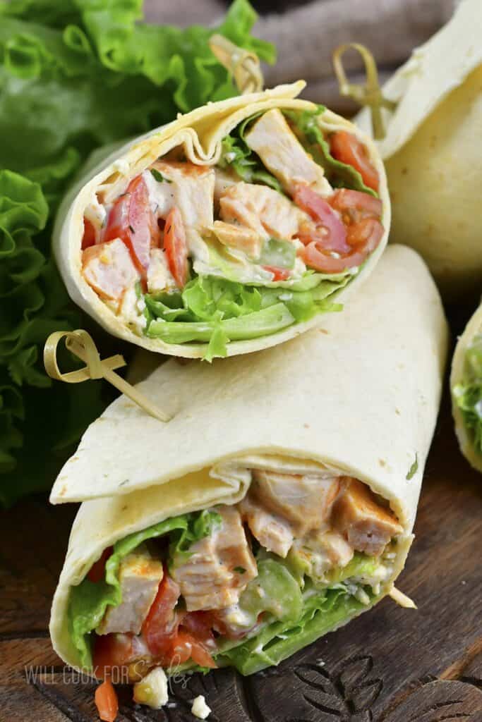 two buffalo chicken wrap halves stacked.