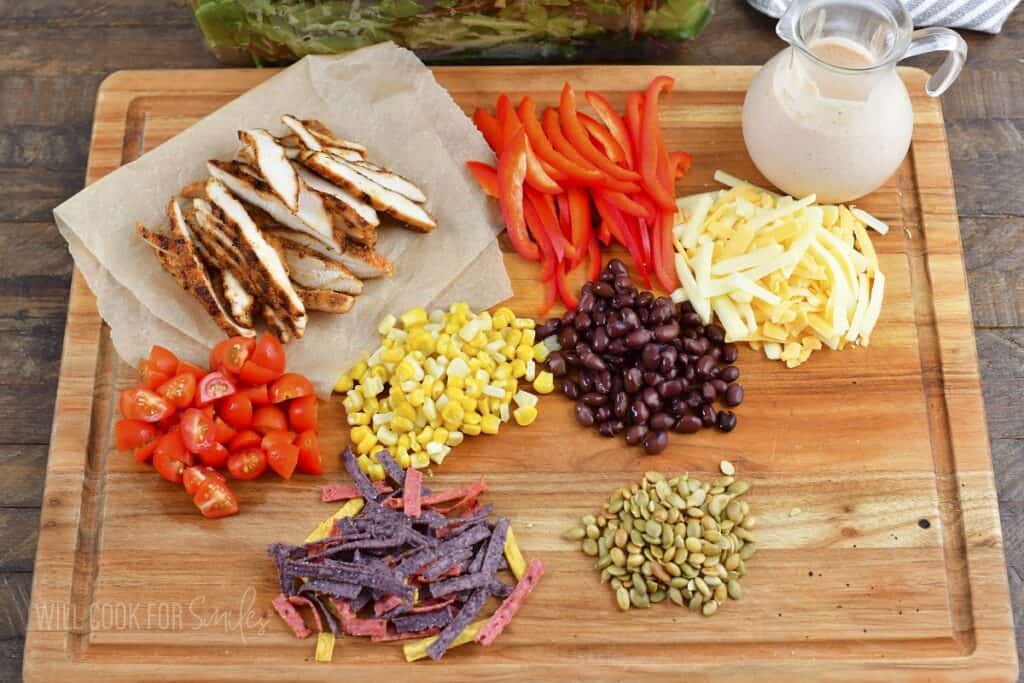 ingredients for spicy southwest salad on cutting board.