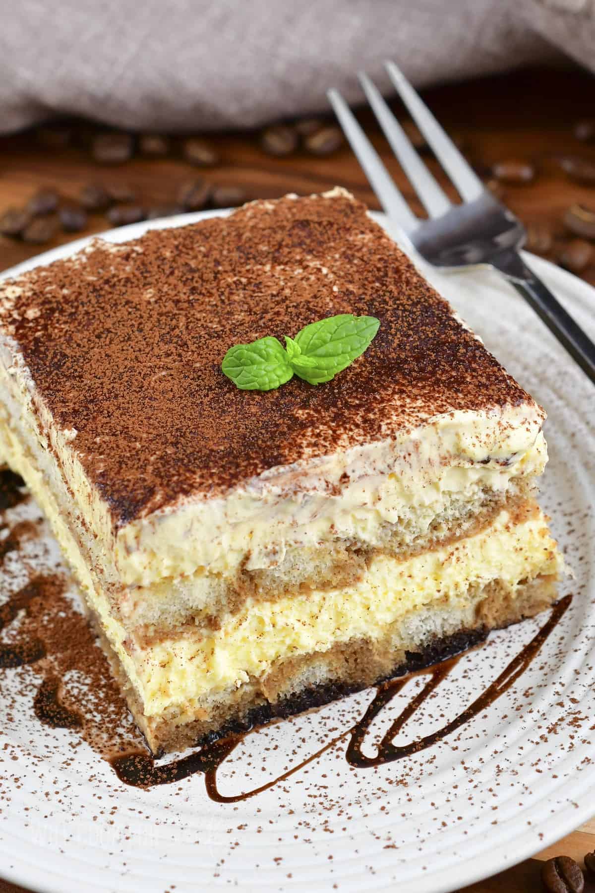 top closeup of a slice of tiramisu in a plate.