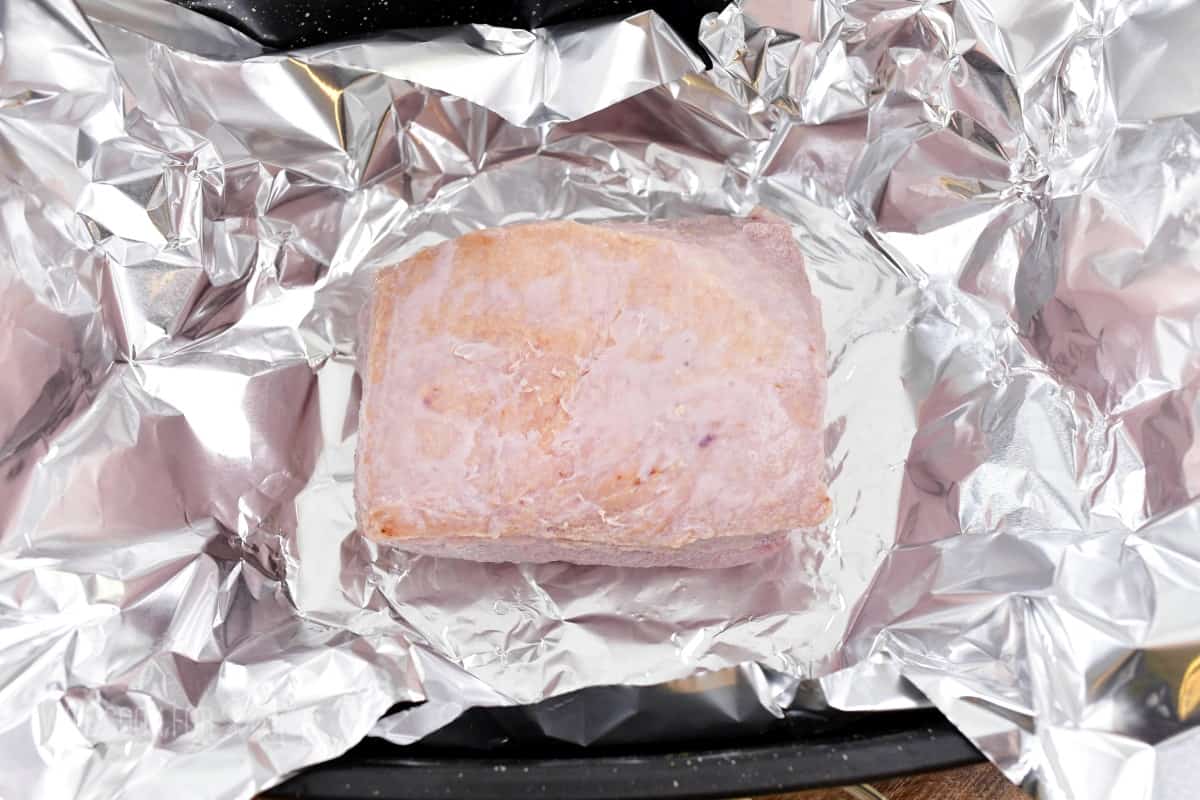 corned beef brisket on aluminum foil.
