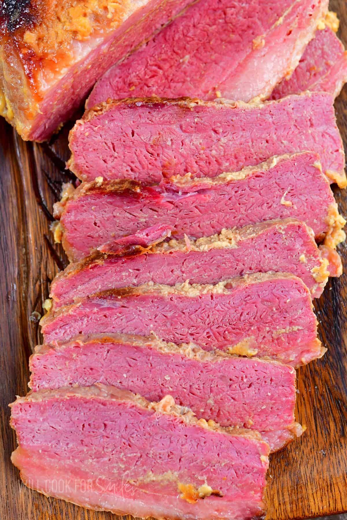 top view of sliced corned beef brisket in the board.