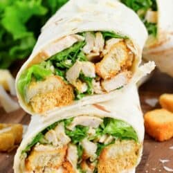 closeup of two stacked chicken caesar wraps.