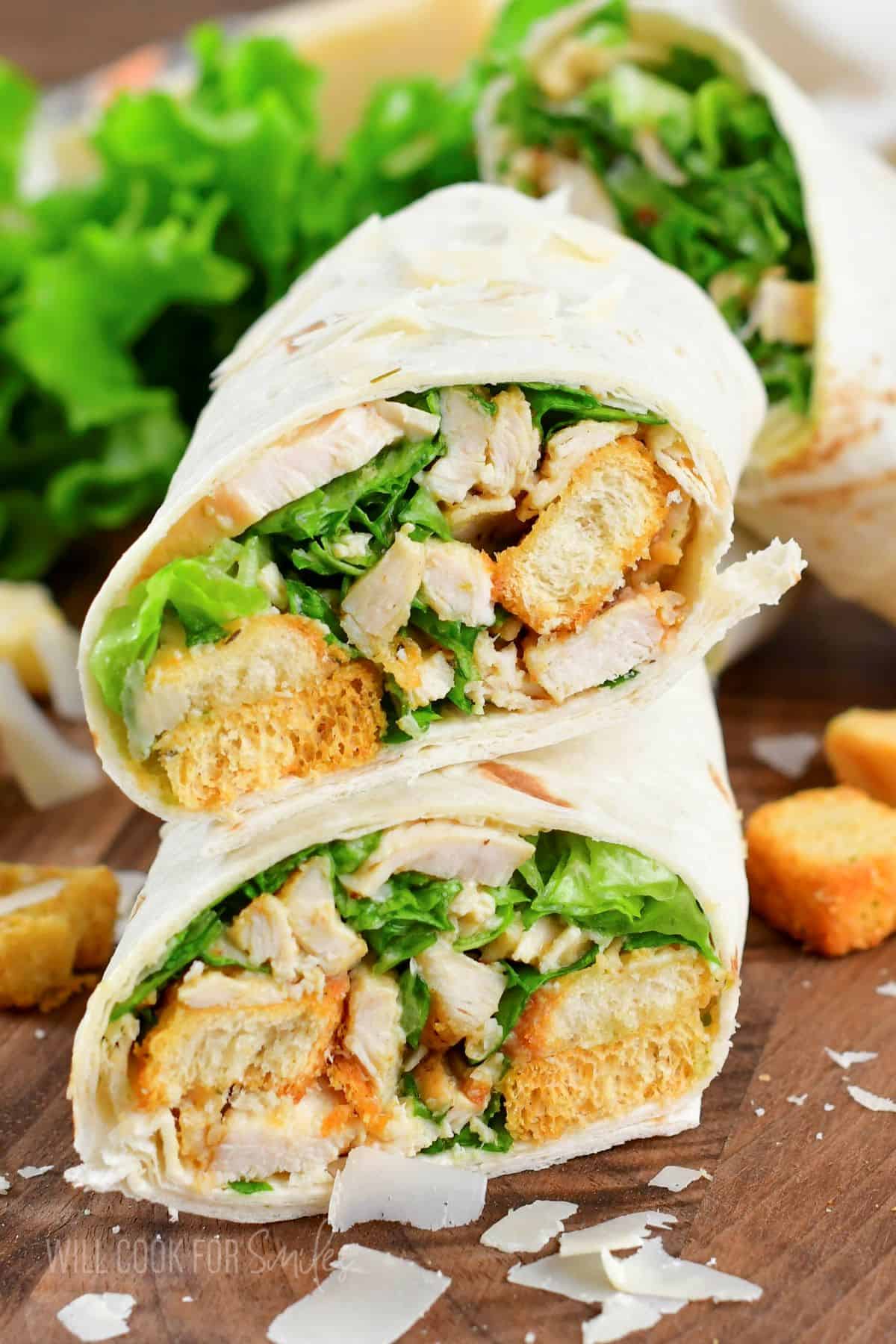 closeup of two stacked chicken caesar wraps.