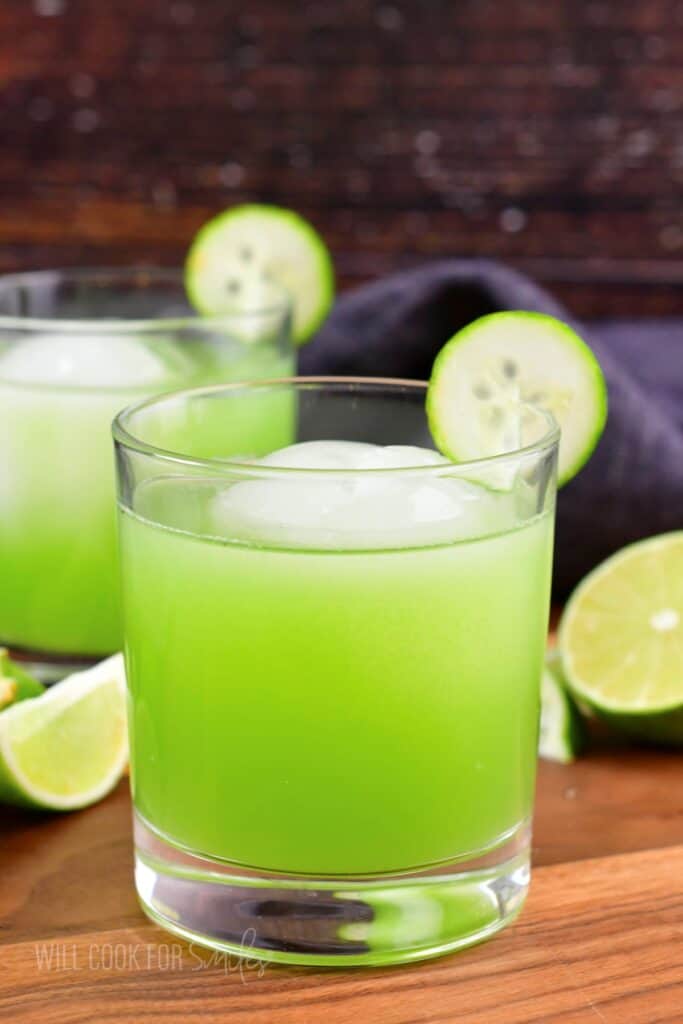closeup of the glass with bright green cocktail.
