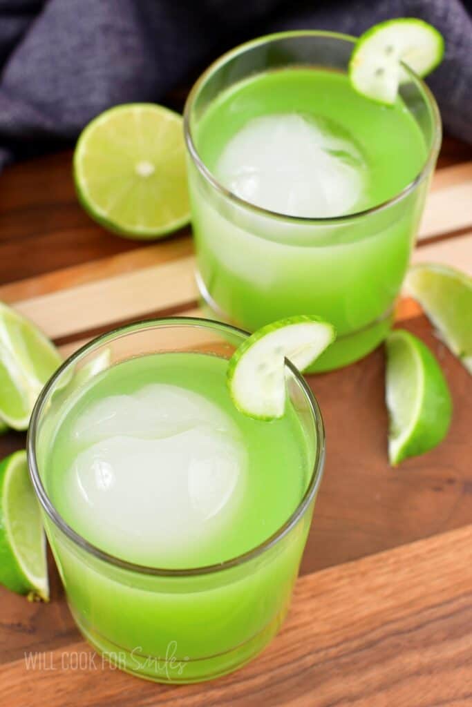 top view of the bright green cocktails in two glasses.