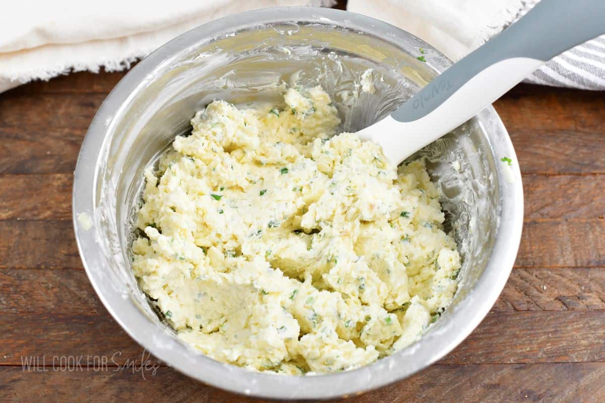 mixed cheese mixture for the dip in a mixing bowl.