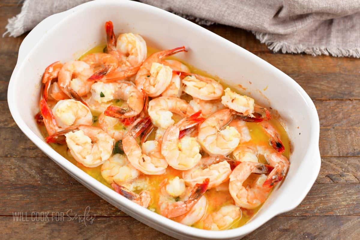 baked shrimp in butter in baking dish.