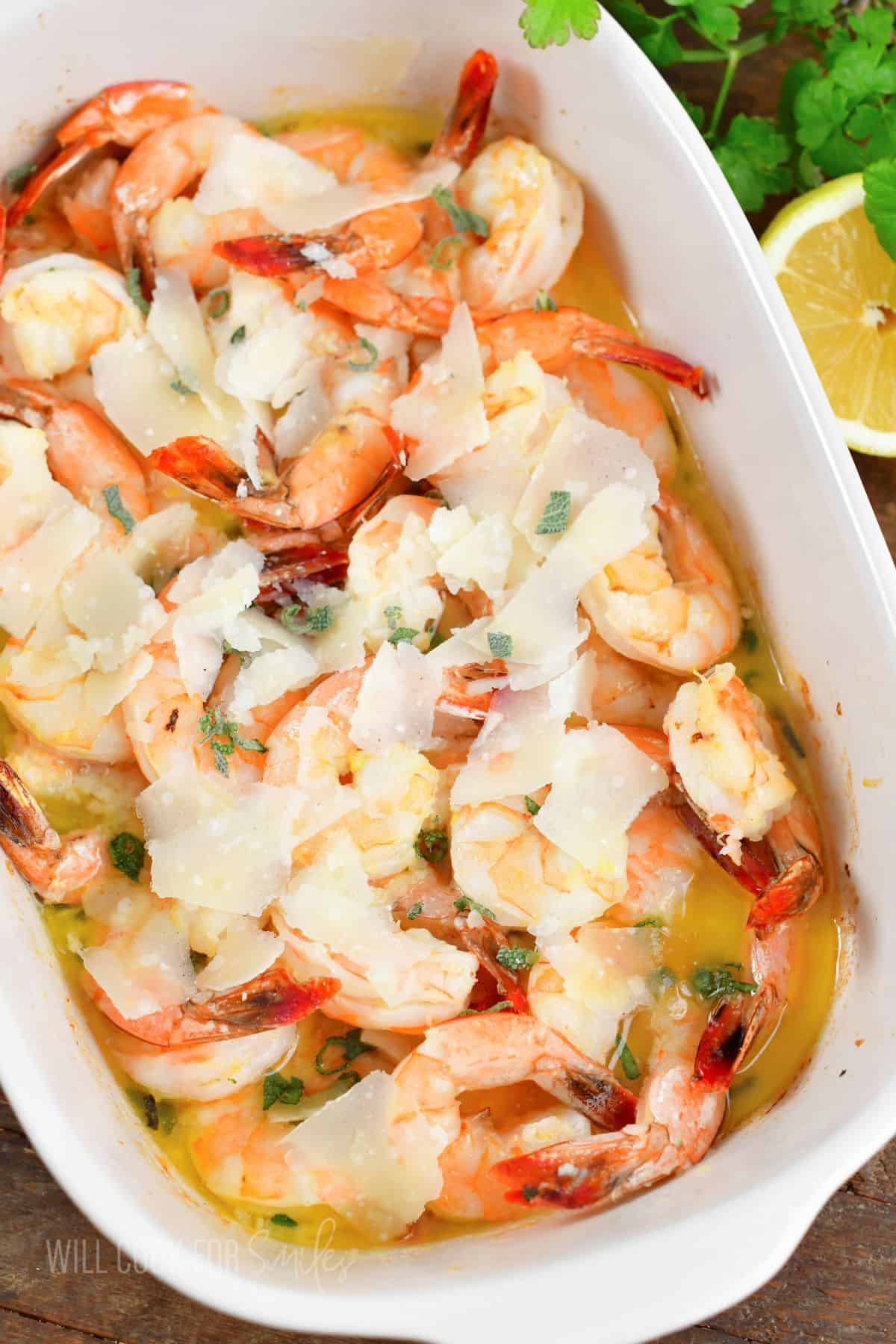 top view of baked garlic butter shrimp in baking dish.