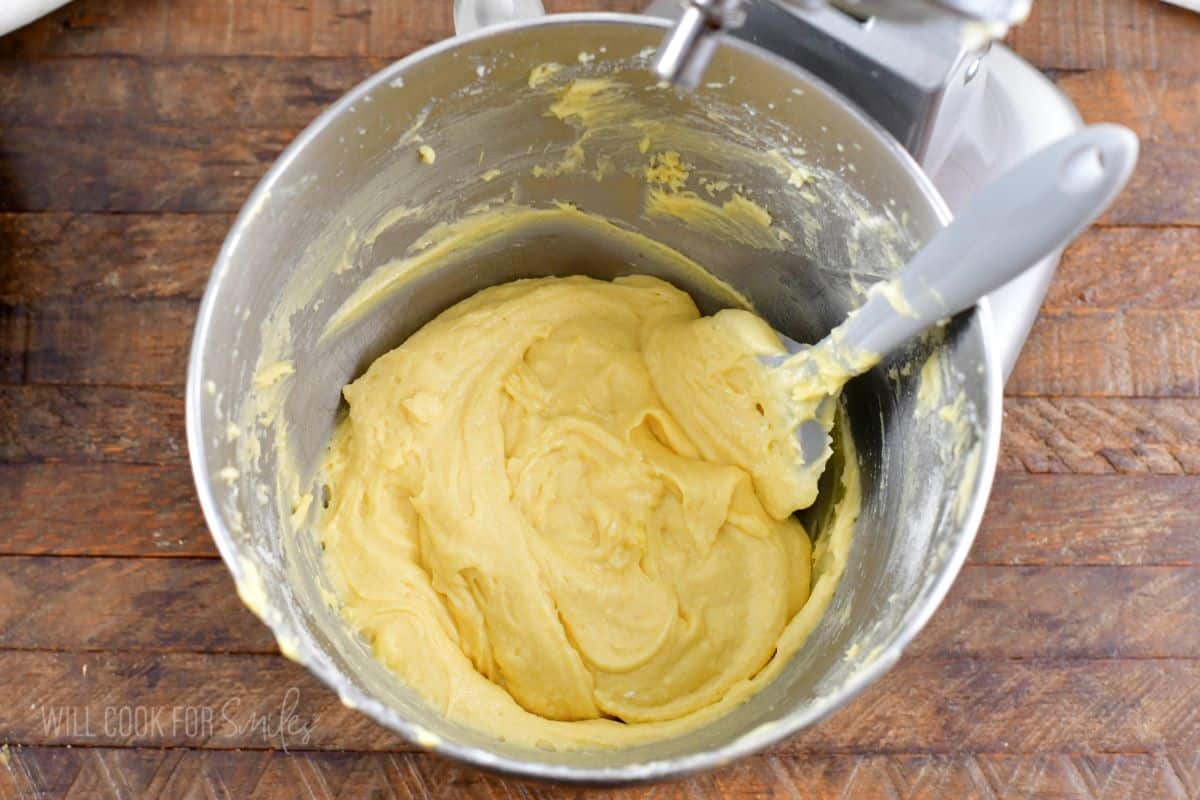 yellowish cake batter in the mixing bowl and spatula.