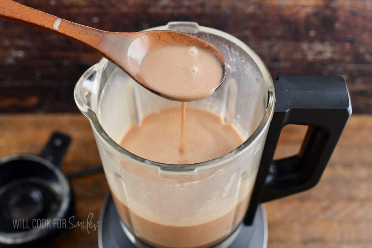 Spooning out Irish cream from the blender.