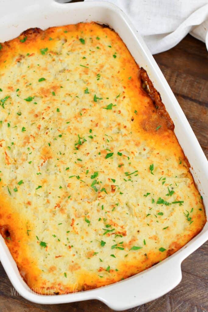 top view of baked shepherd's pie in white baking dish.