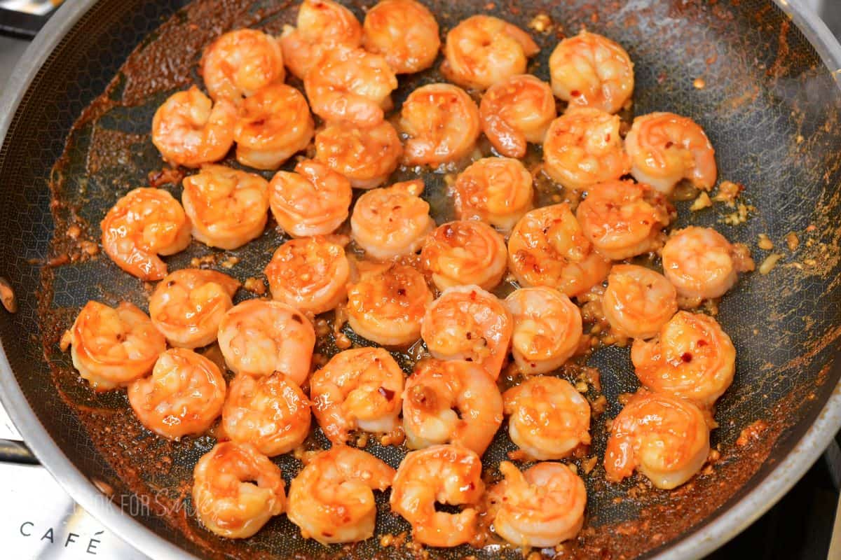 cooked shrimp in Thai style sauce in a pan.
