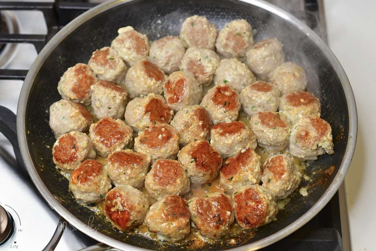 cooking turkey meatballs in the cooking pan.