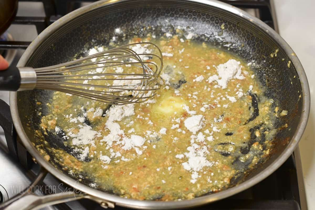 whisking in flour into butter and meatball juices.