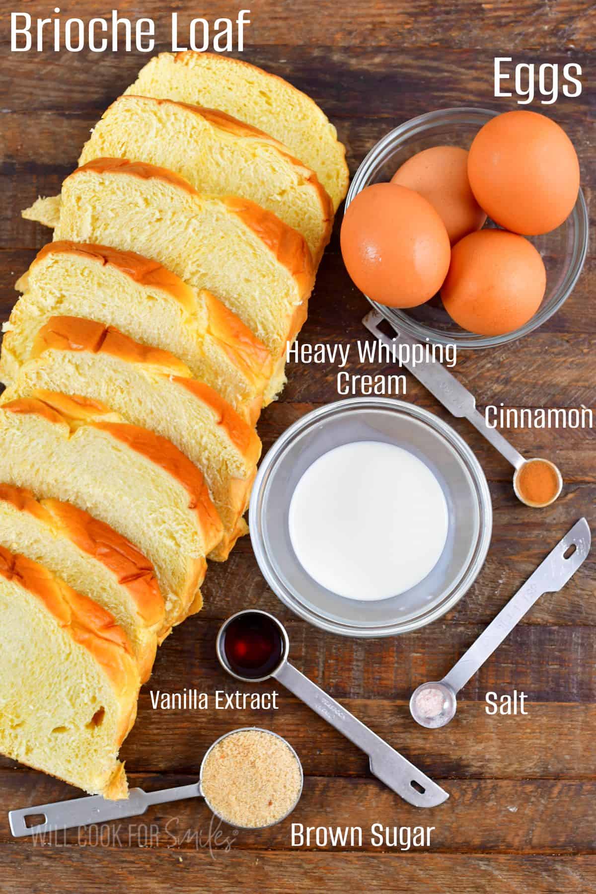 ingredients for French toast on wooden board with labels.