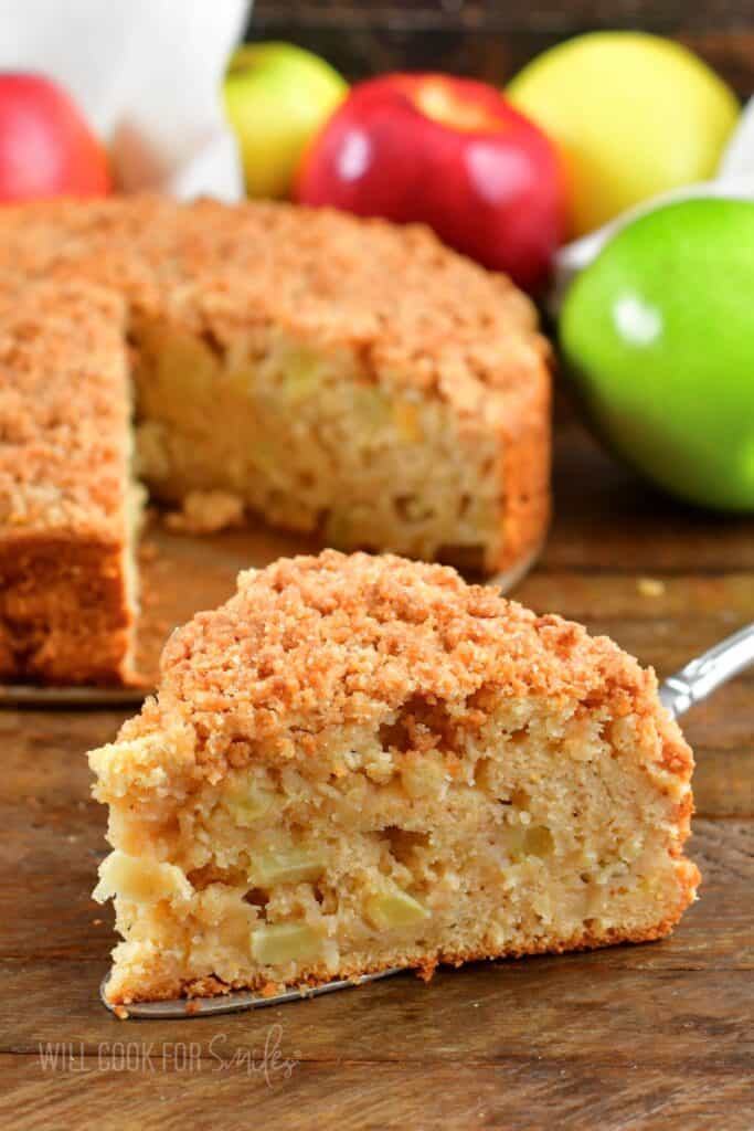 side view of the slice of Irish apple cake on a metal spatula.