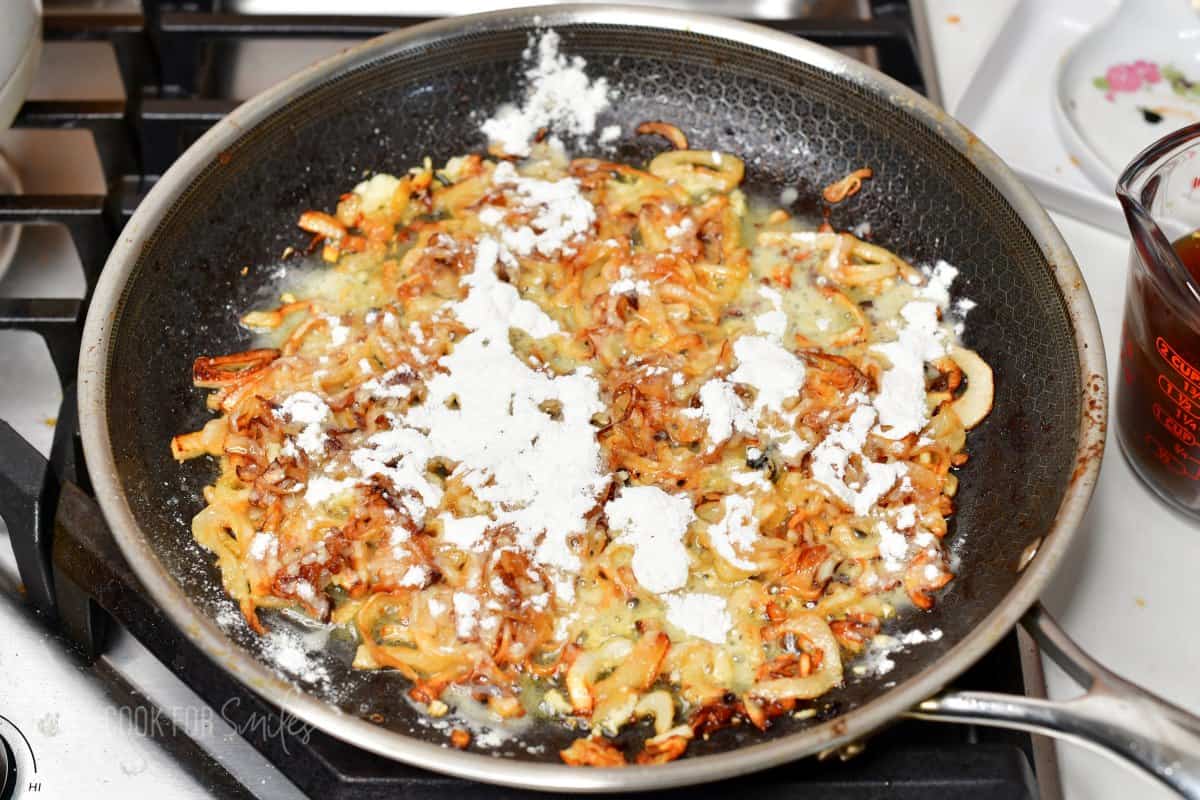 sprinkled flour over the sauteed onions in the pan.