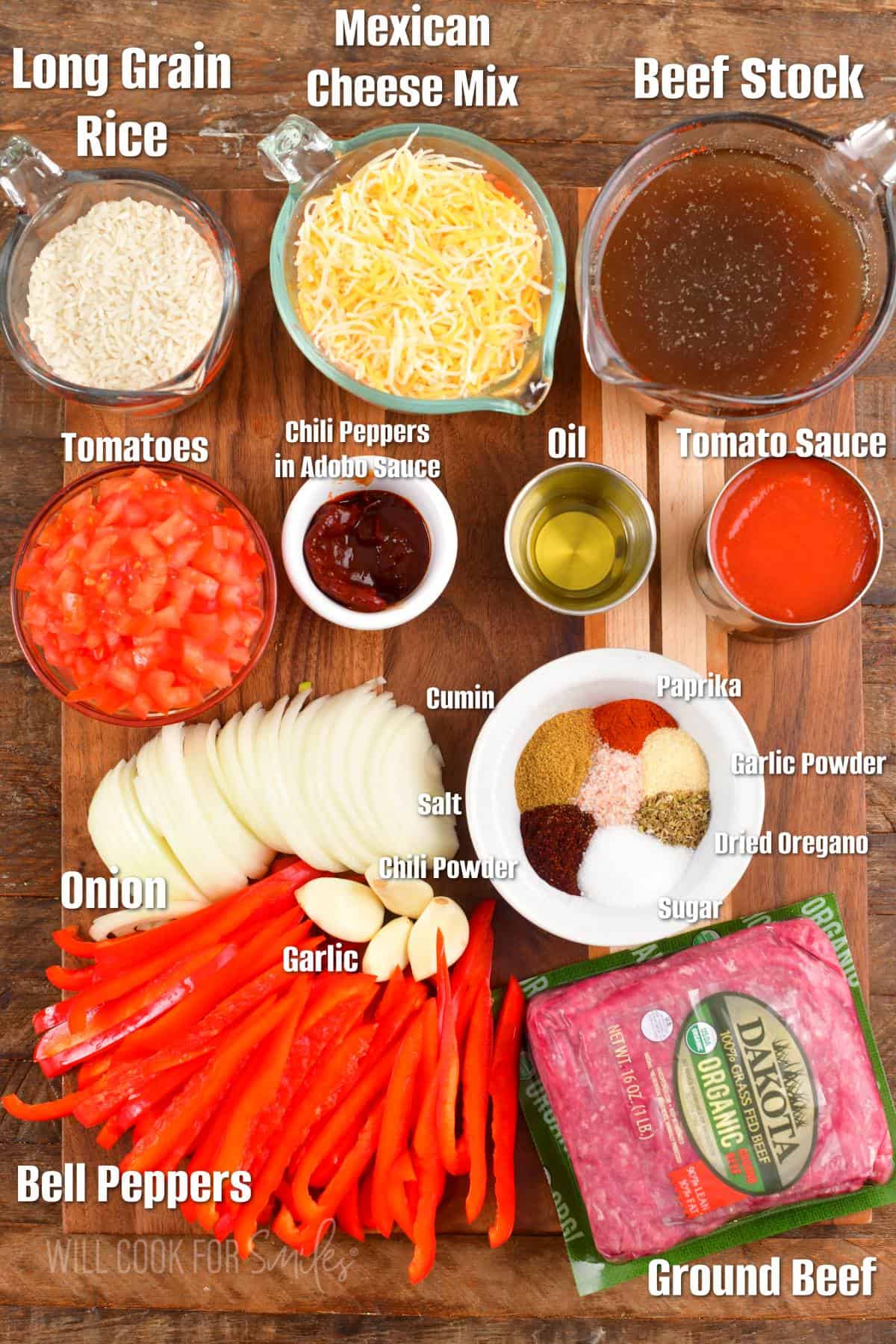 labeled ingredients for beef enchilada casserole on the wooden board.