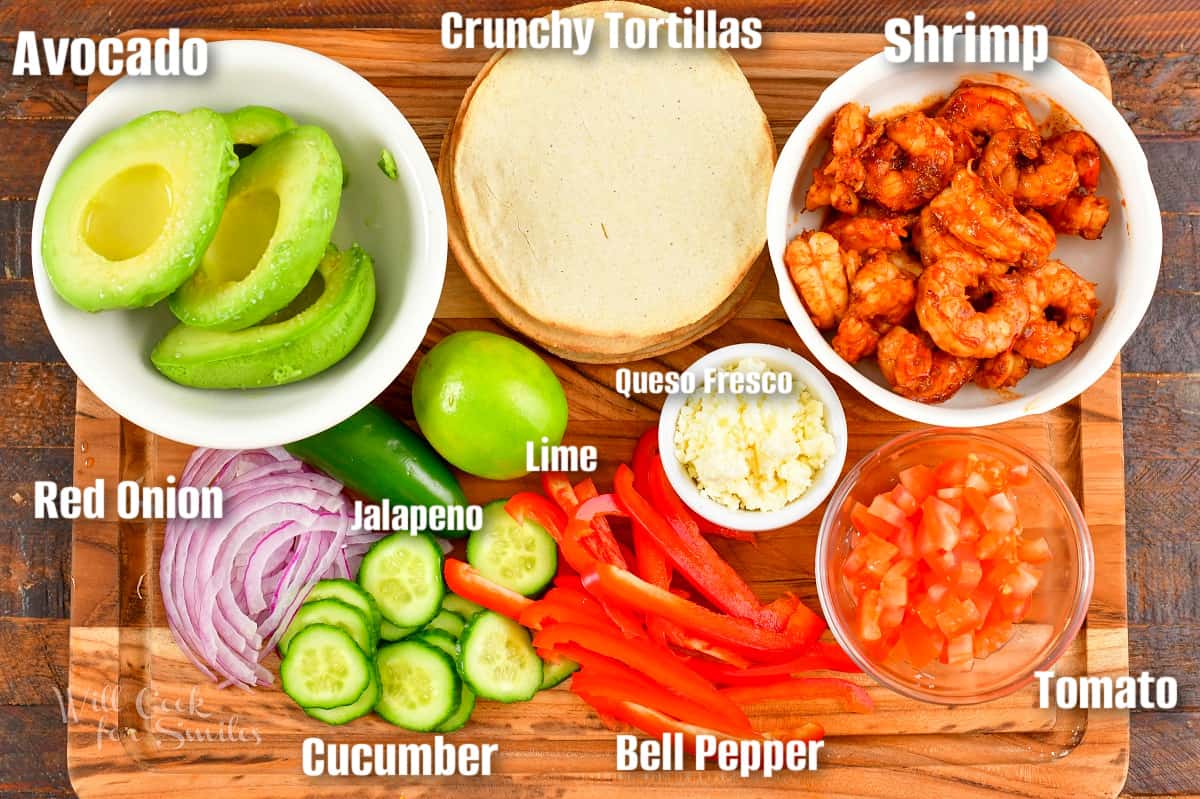 labeled ingredients to build tostadas on the wooden board.