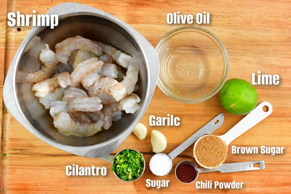 labeled ingredients to marinate shrimp for tacos on the cutting board.