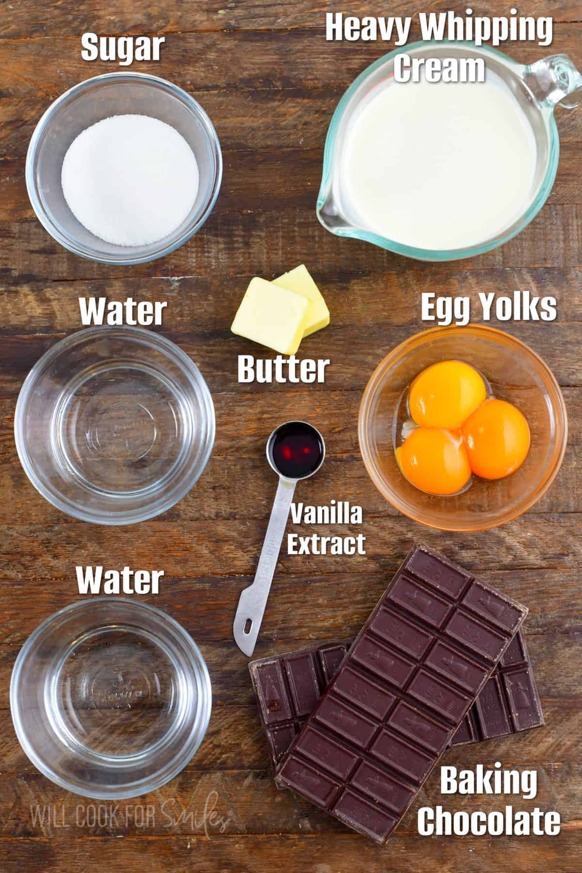 labeled ingredients for making chocolate mousse on wooden board.