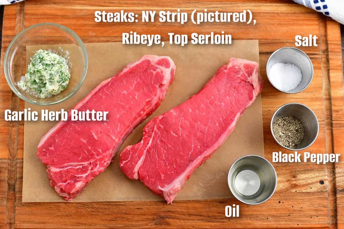 labeled ingredients for making pan seared steaks on a cutting board.