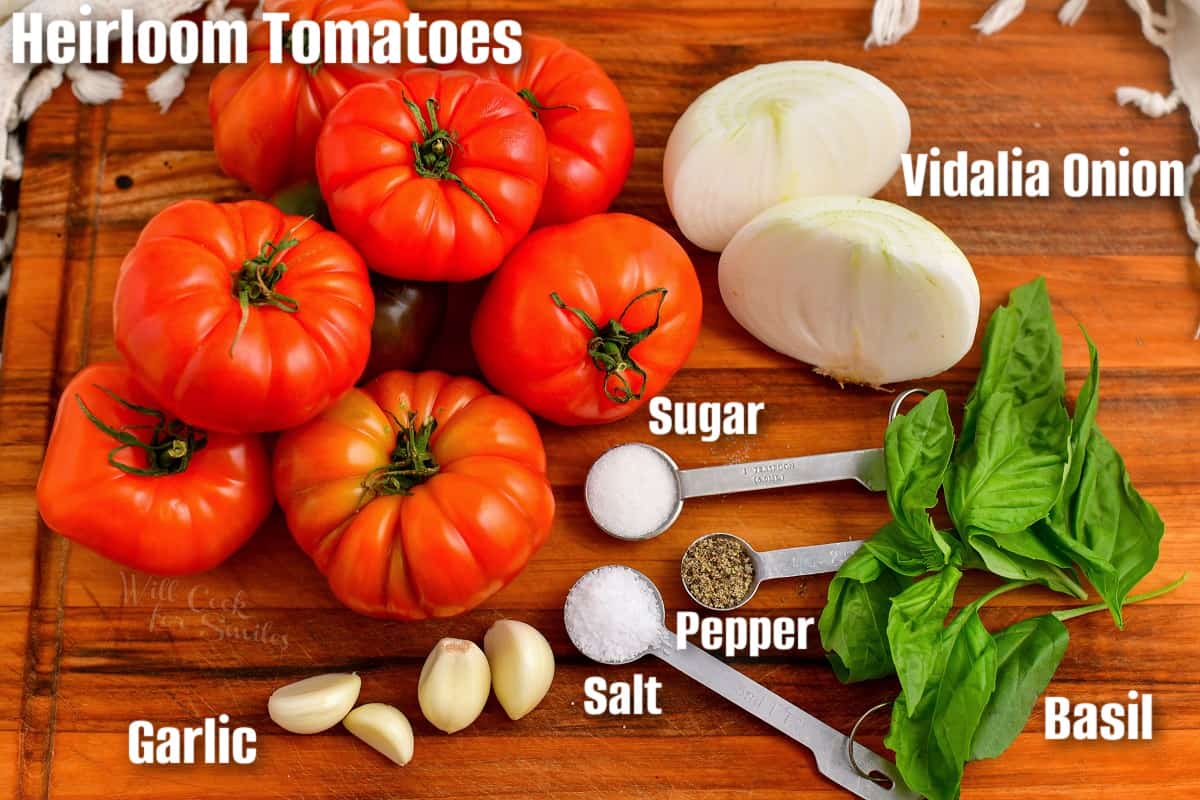 labeled ingredients to make pomodoro sauce on the cutting board.